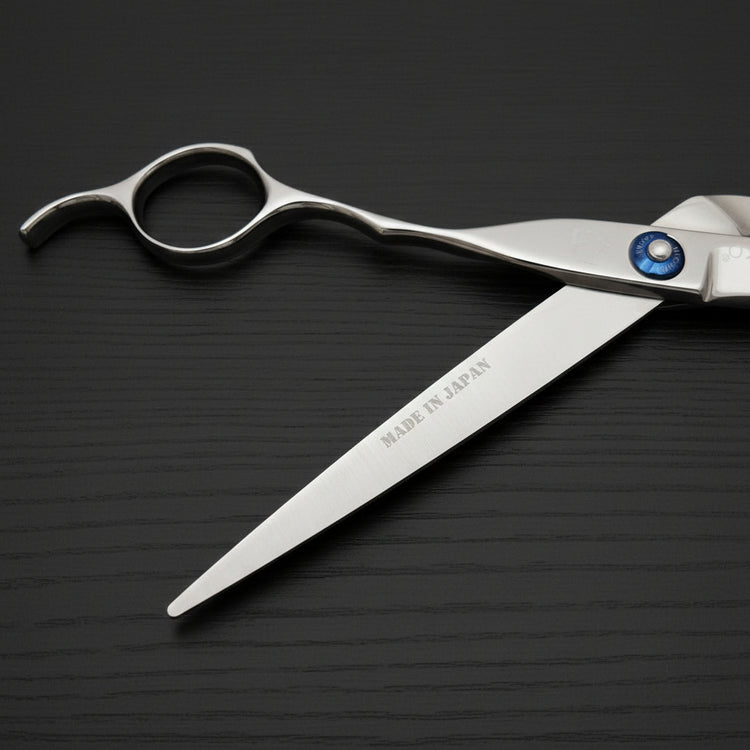 Hair cutting shears with 'Made in Japan' text on a black background