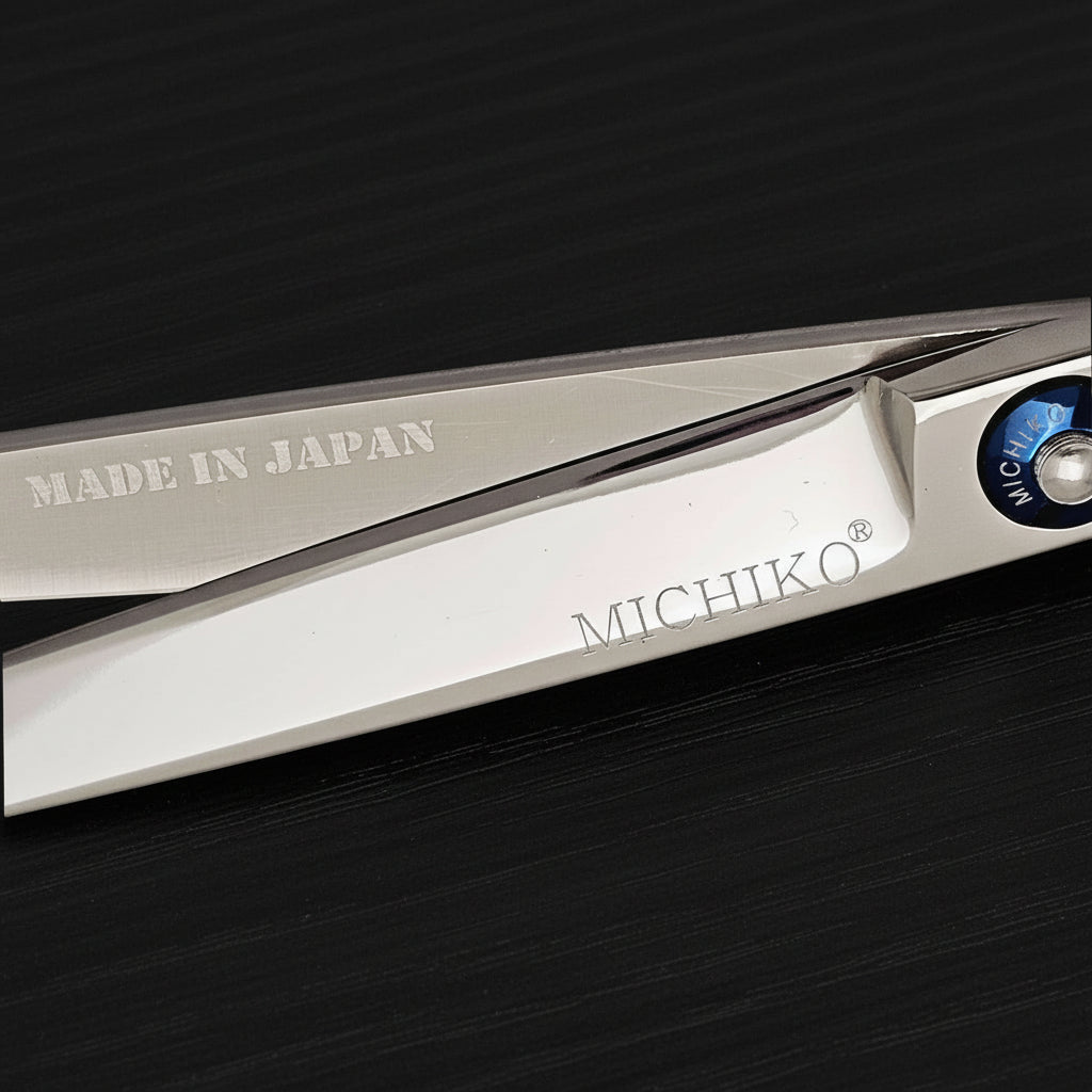 Hair shears with 'Made in Japan' and 'Michiko' branding on a black background