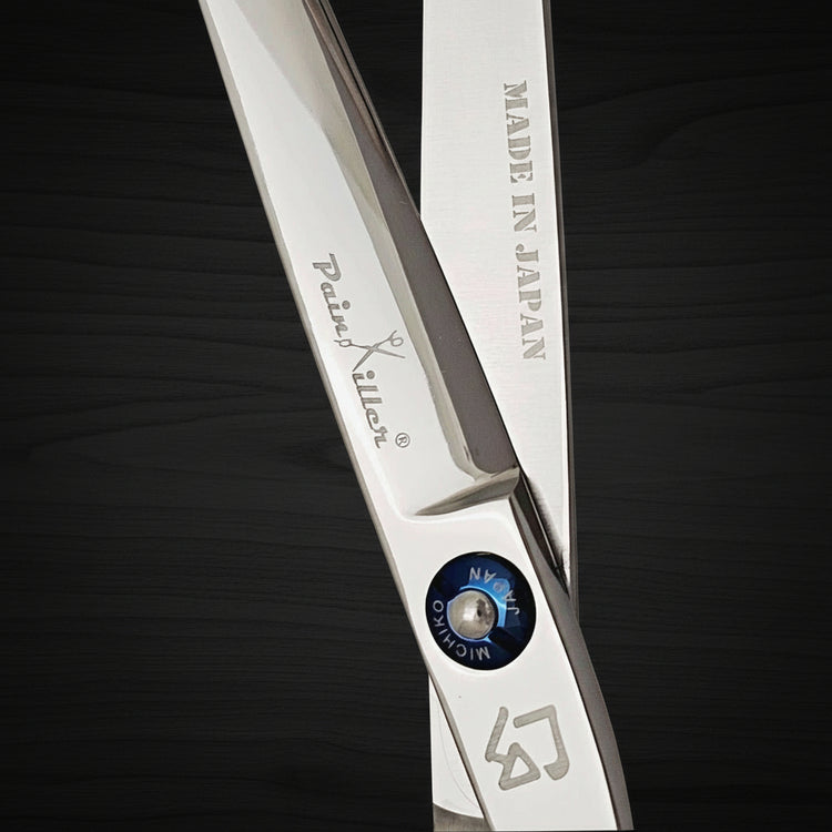 Swivel hair shears with 'Made in Japan' text on a black background