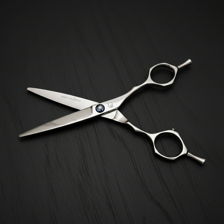 Hair cutting shears on a black background