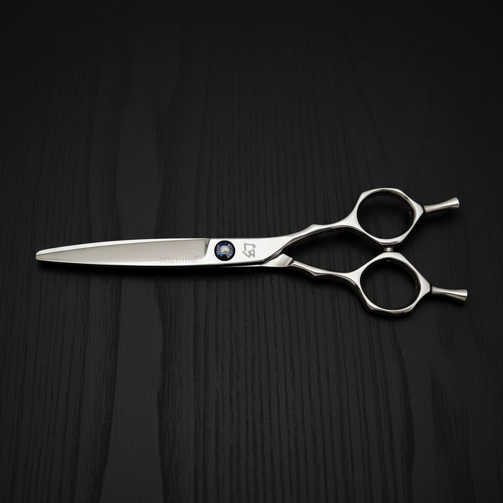 Pair of silver hair scissors with symmetric handle on a white background