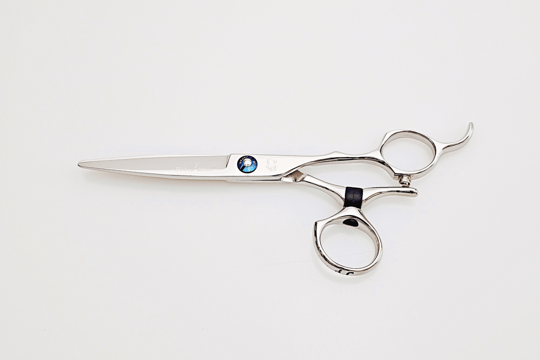 Swivel hair-cutting scissors on a white background