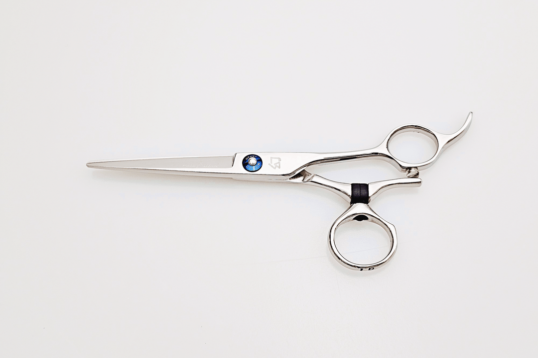 Swivel hair scissors on a marble surface