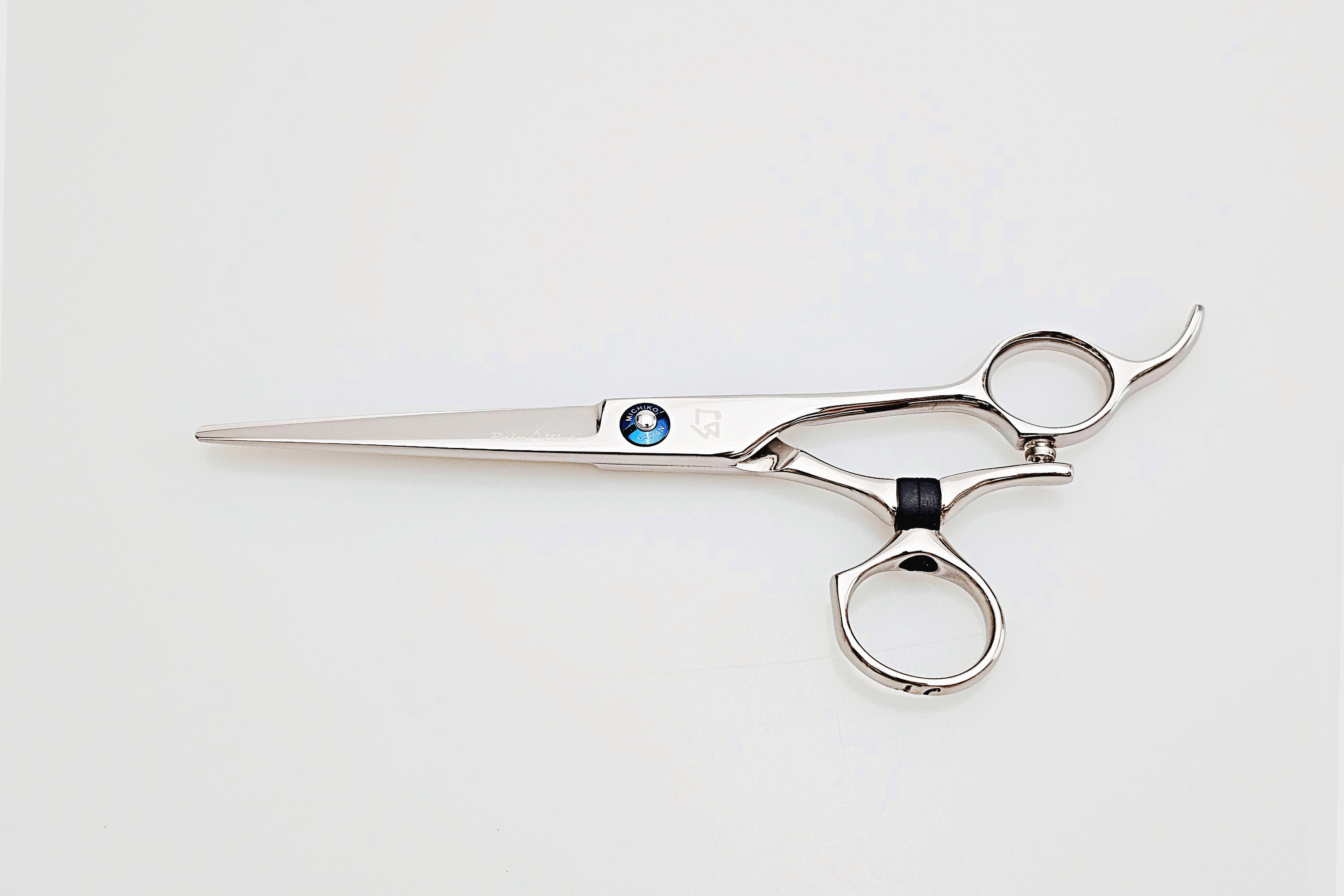 Swivel hair cutting scissors on a white background