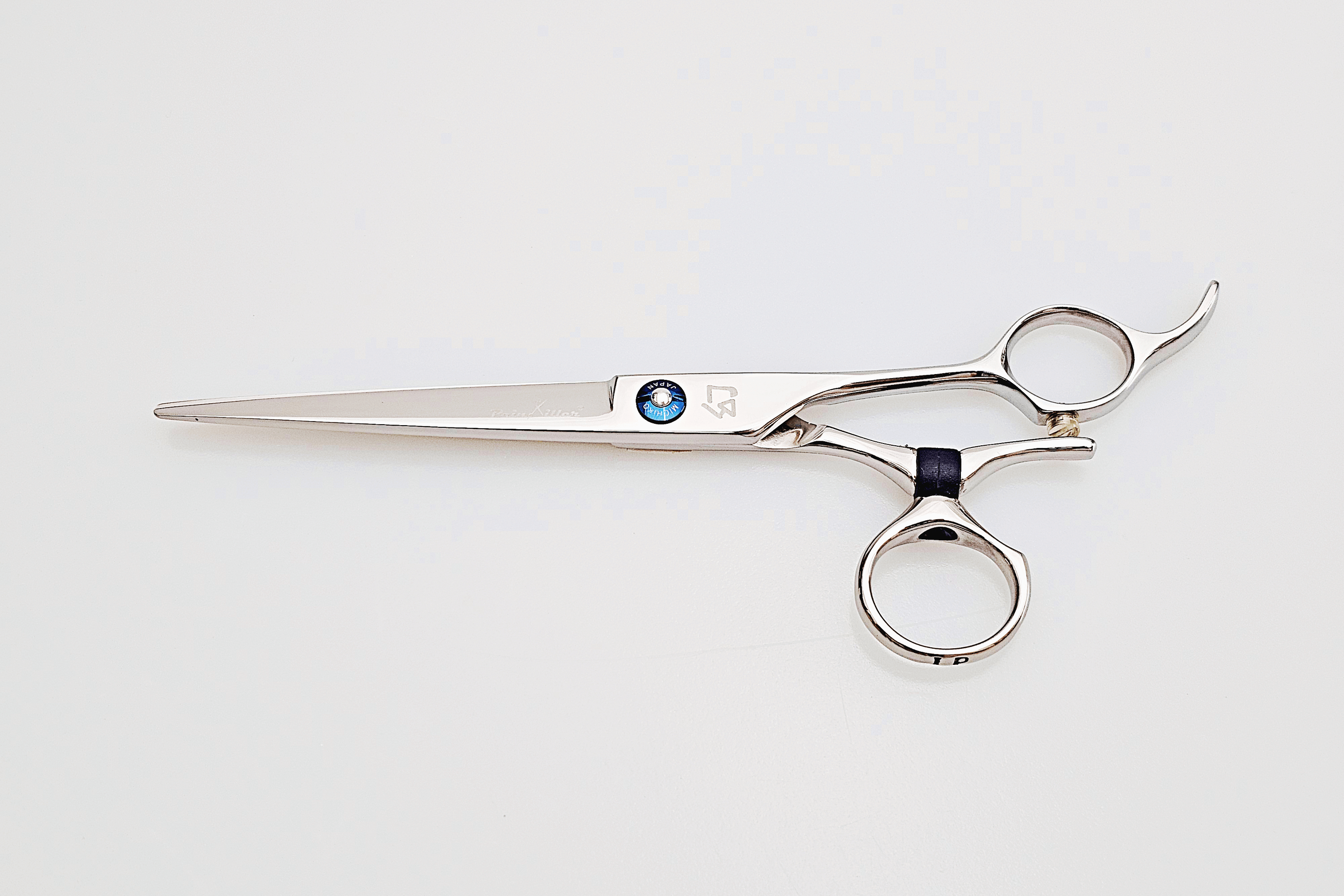 Swivel hair cutting scissors on a white background