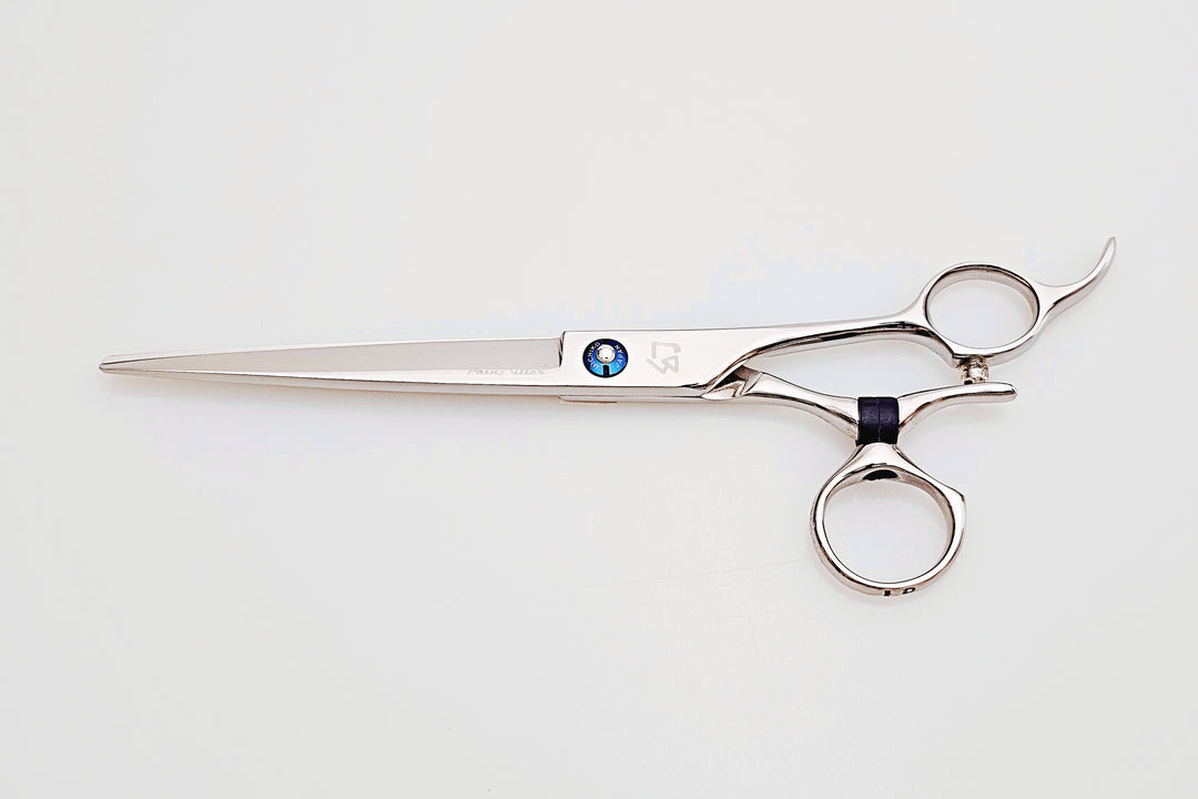 Swivel barber shears on a white surface