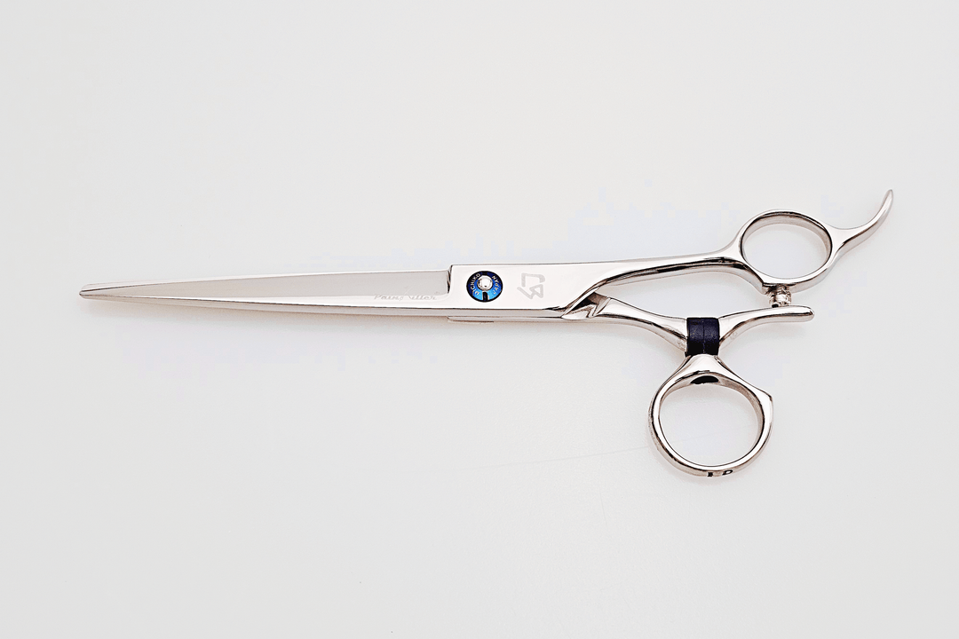 Swivel barber shears on a white surface