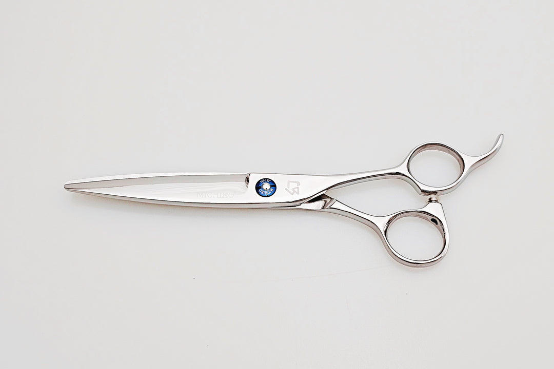 Hair scissors with a brand logo on a white background