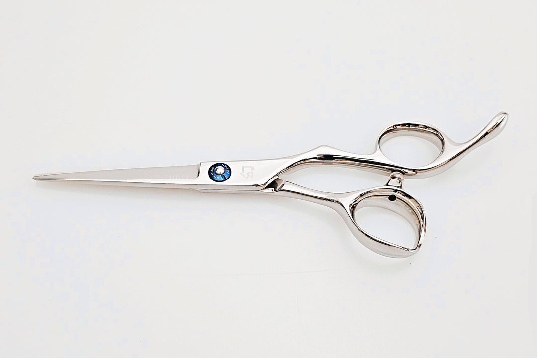 Barber shears on a white surface