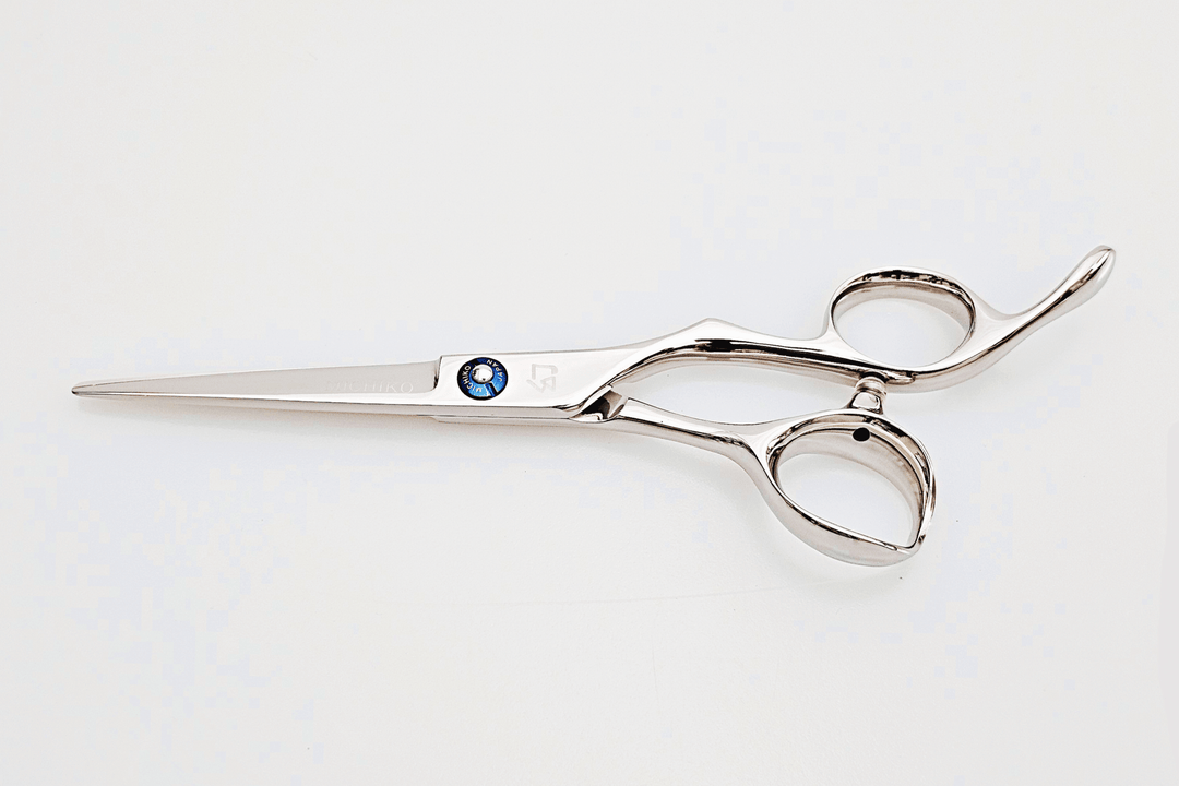 Barber shears on a white surface