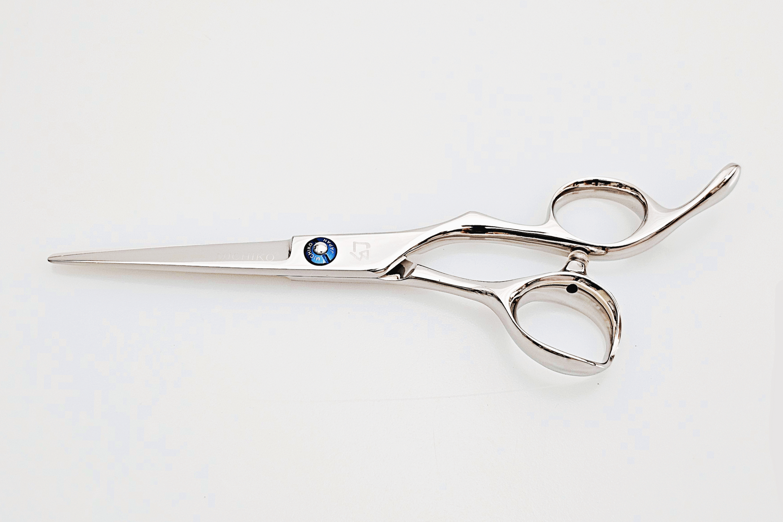 Barber shears on a white surface