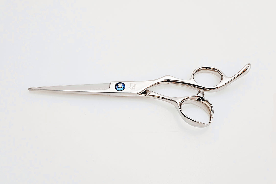 Barber shears on a white surface