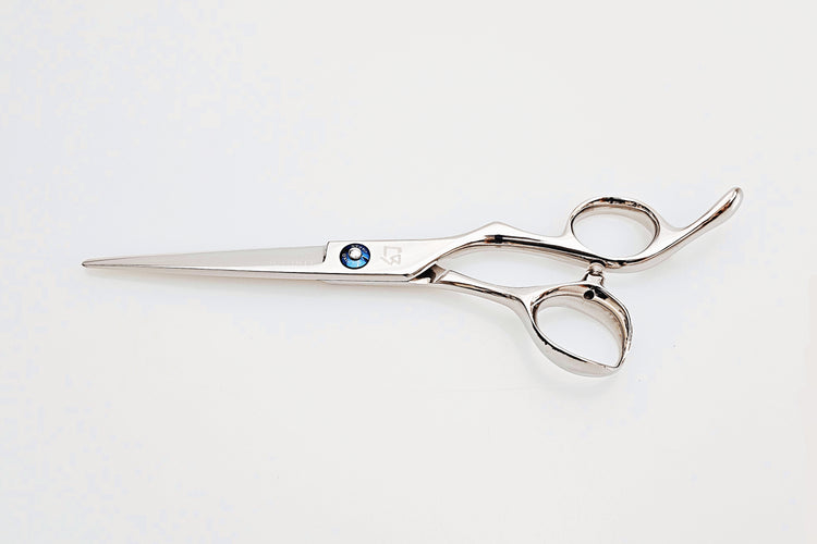 Barber shears on a white surface