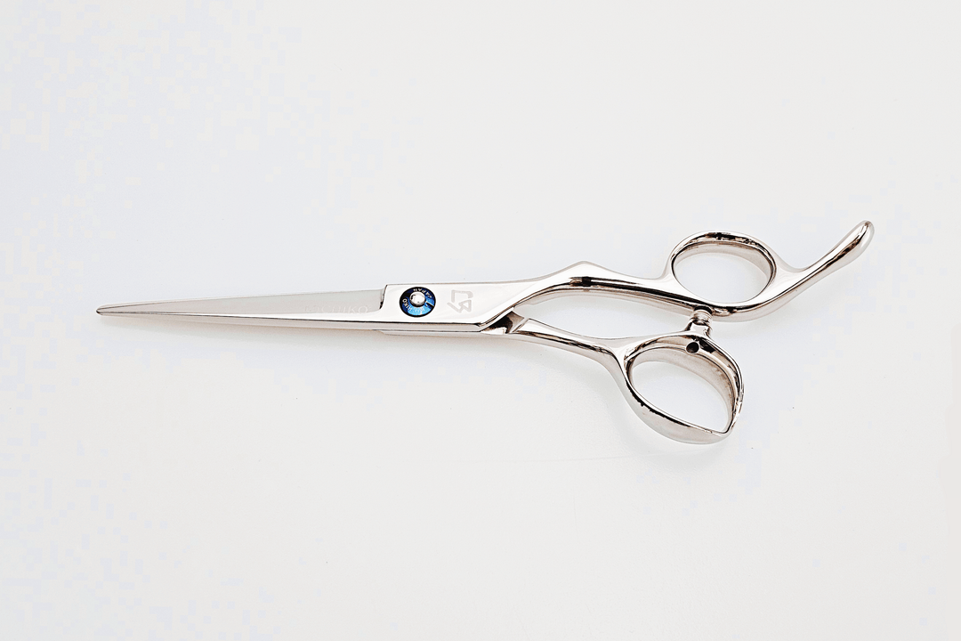 Barber shears on a white surface