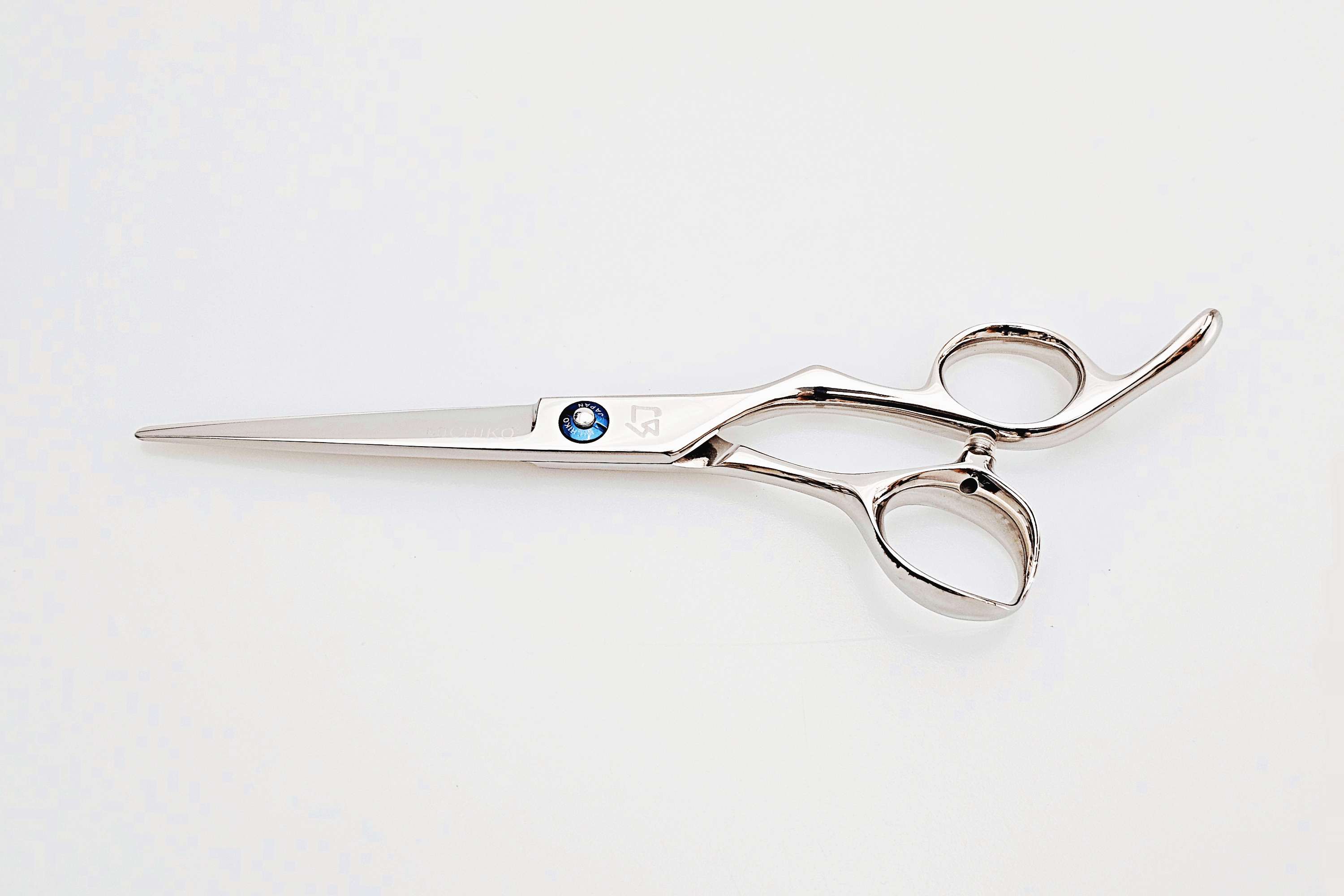 Barber shears on a white surface