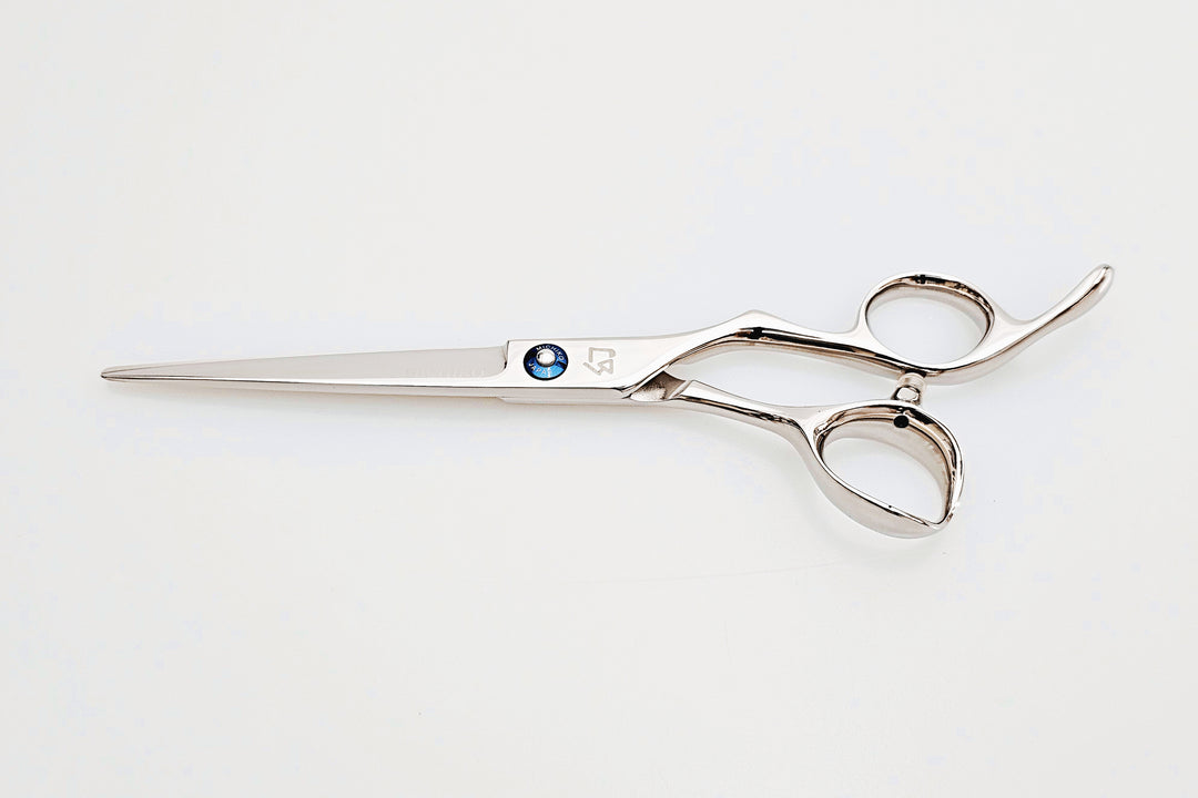 Barber shears on a white surface