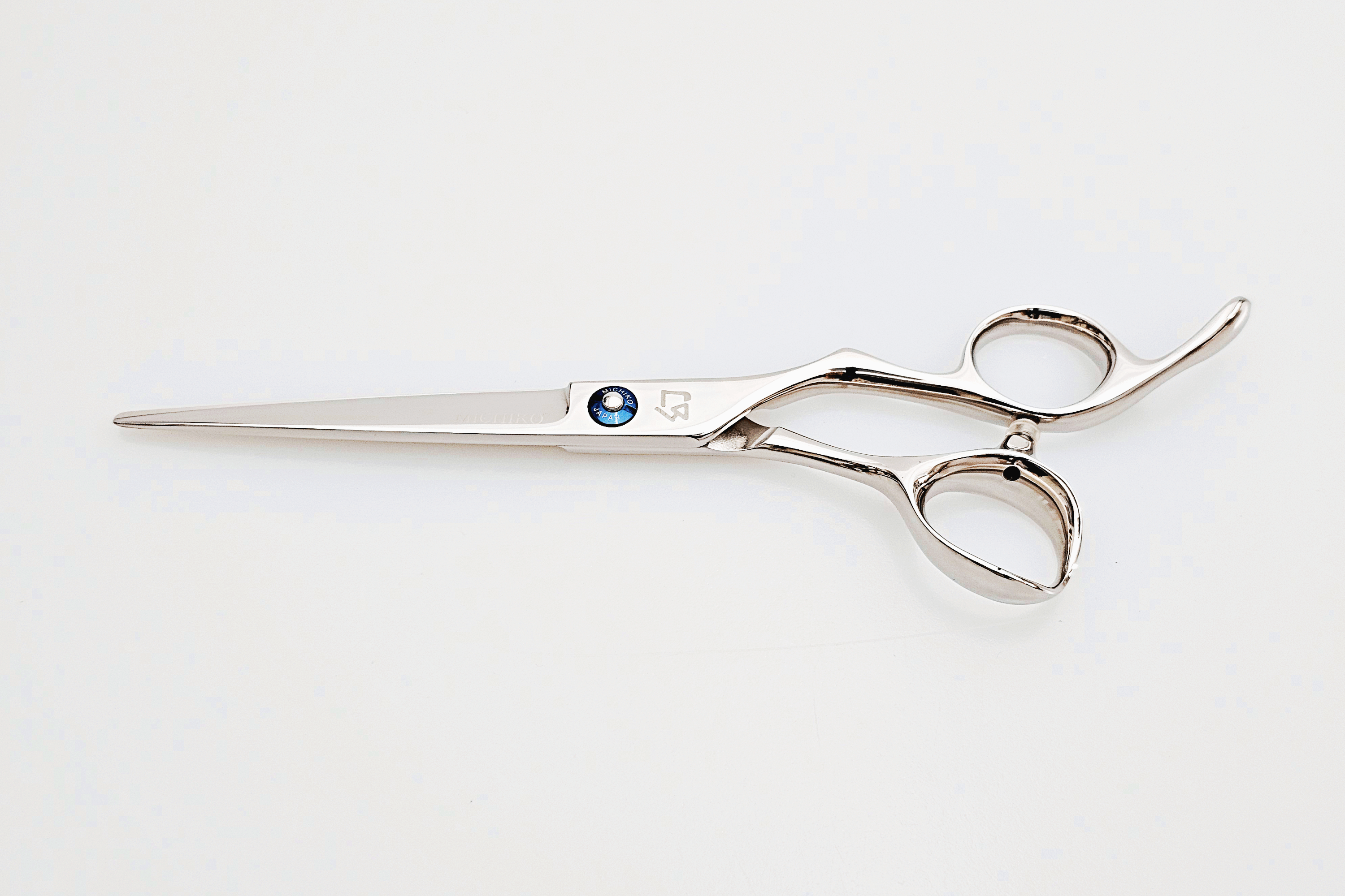 Barber shears on a white surface