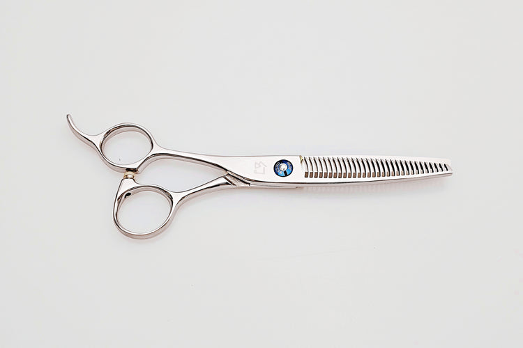 Lefty hair thinning scissors with a brand logo on a light gray background
