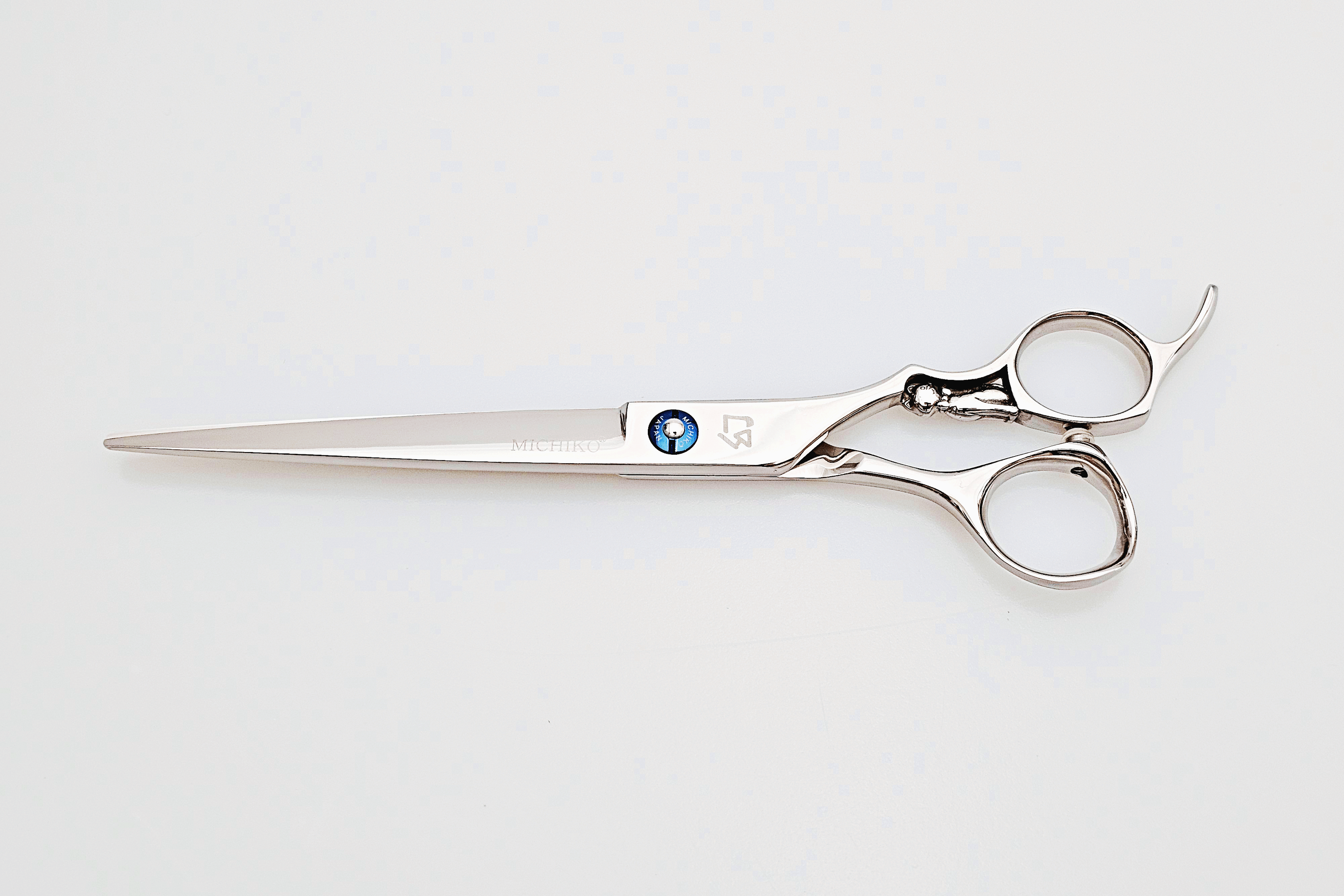 Hair scissors with a brand logo on a white background