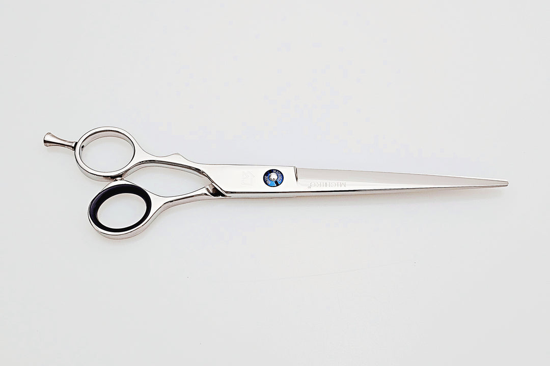 Lefty hair cutting scissors on a white background