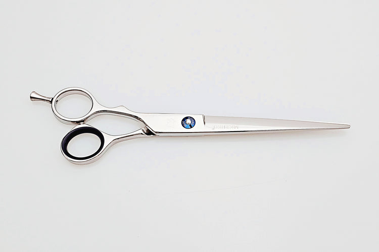 Lefty hair cutting scissors on a white background