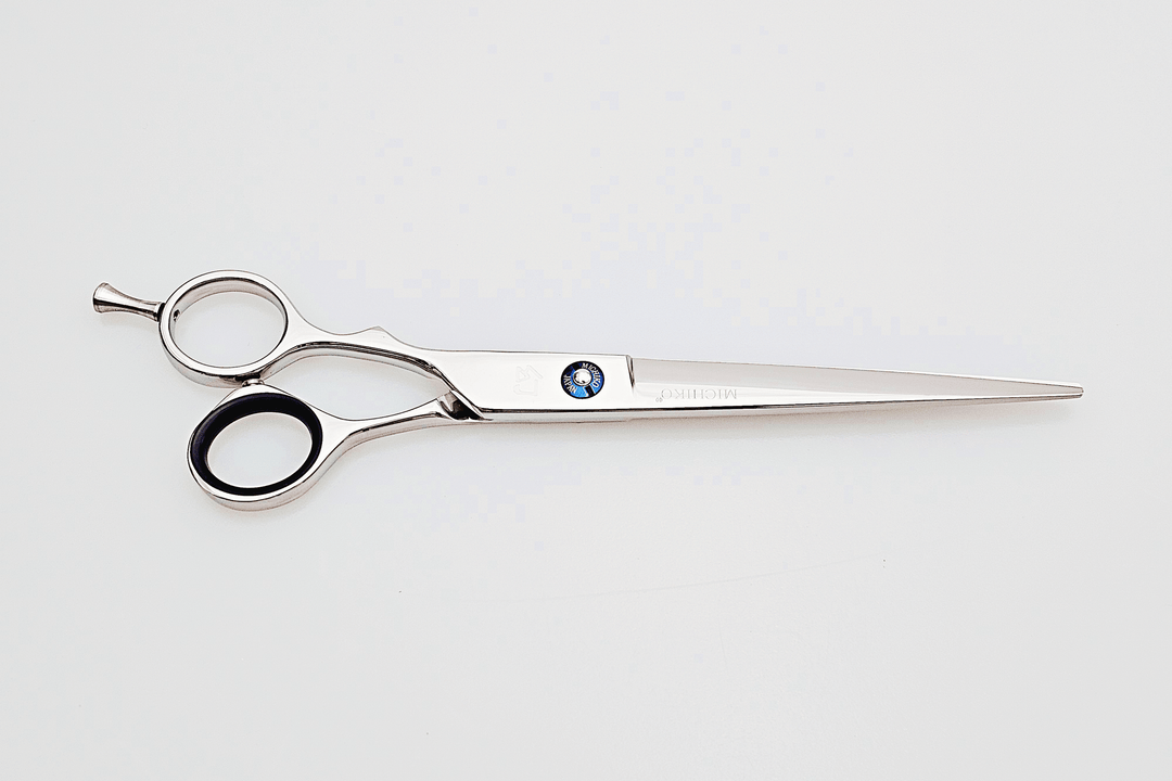 Lefty hair cutting scissors on a white background