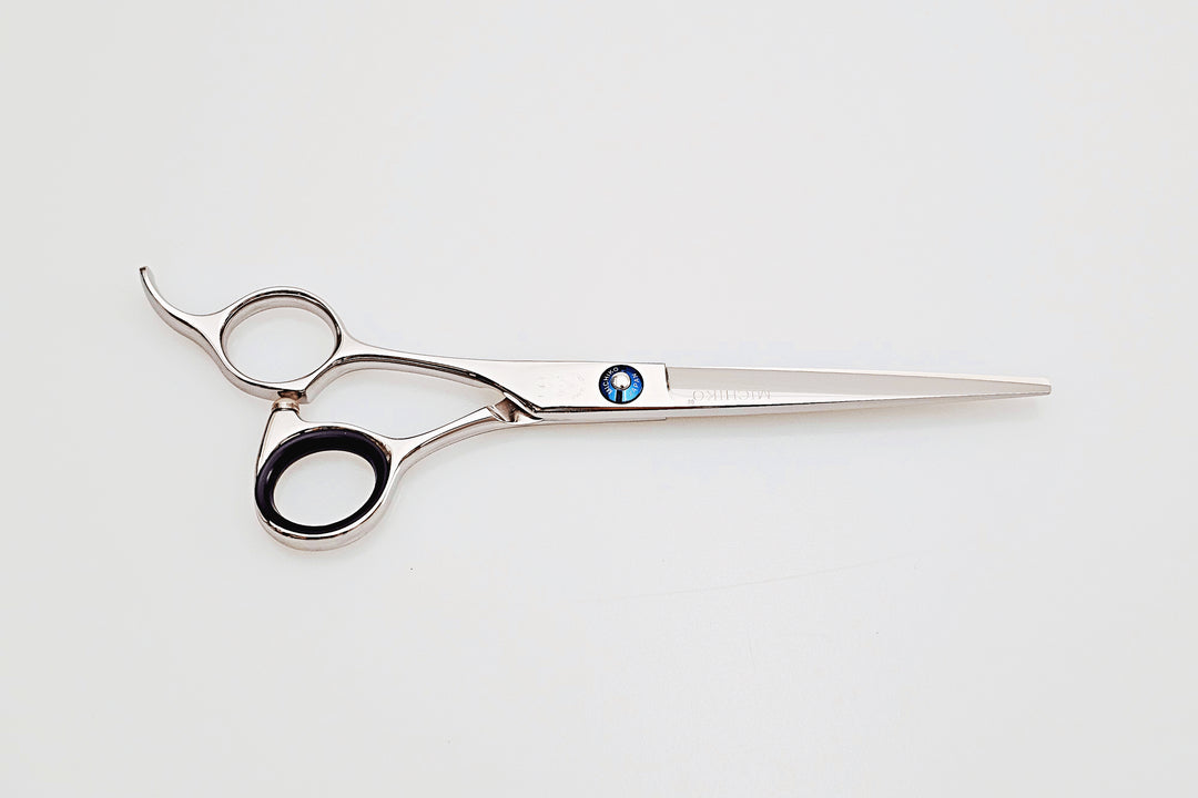 Lefty hair cutting scissors with a brand logo on a white background