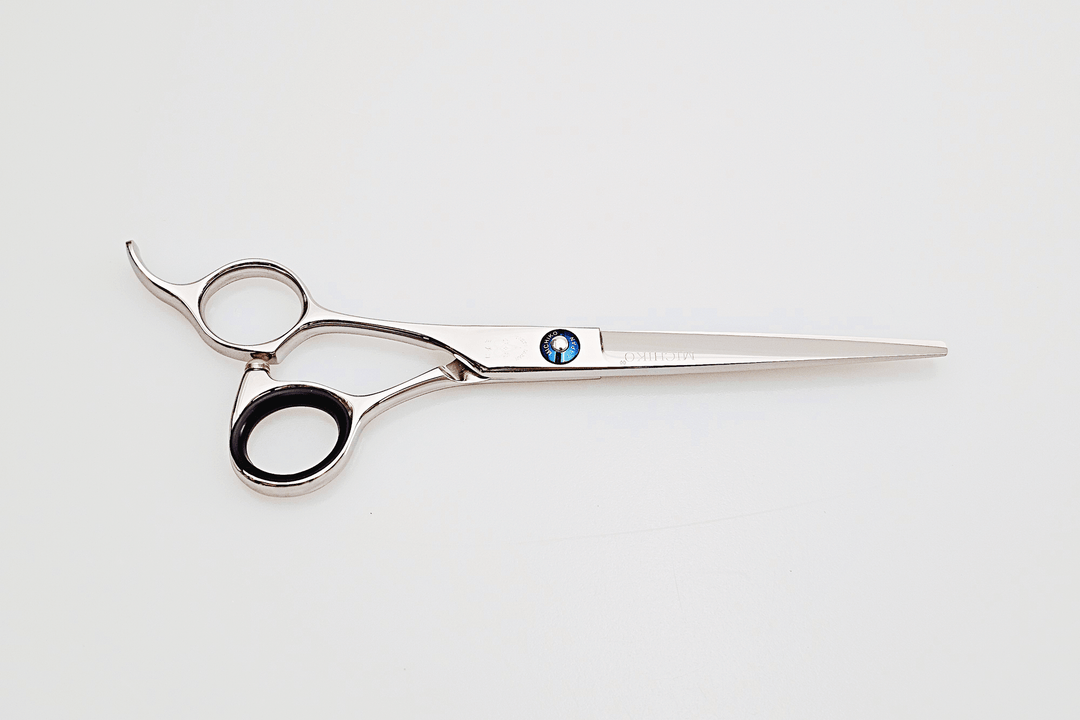 Lefty hair cutting scissors with a brand logo on a white background