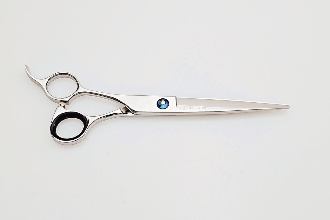 Left handed hair cutting scissors on a white background