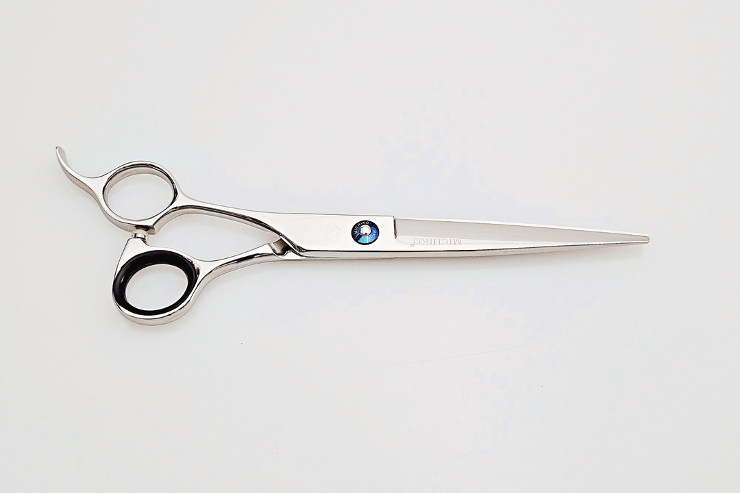 Left handed hair cutting scissors on a white background
