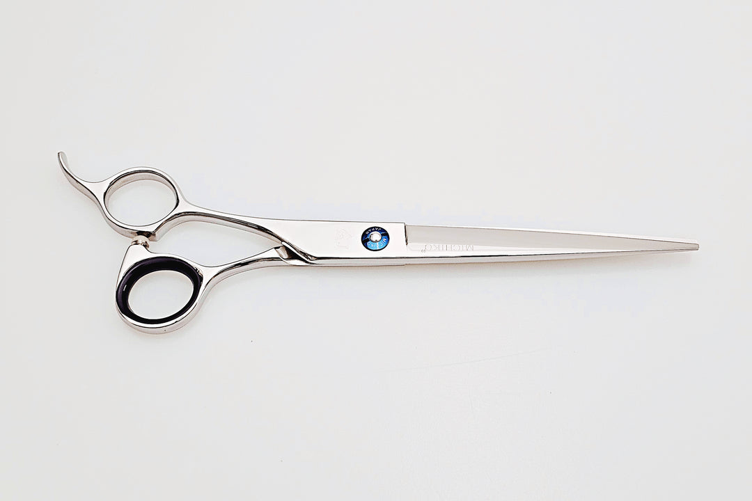 Lefty hair cutting scissors with a brand logo on a white background