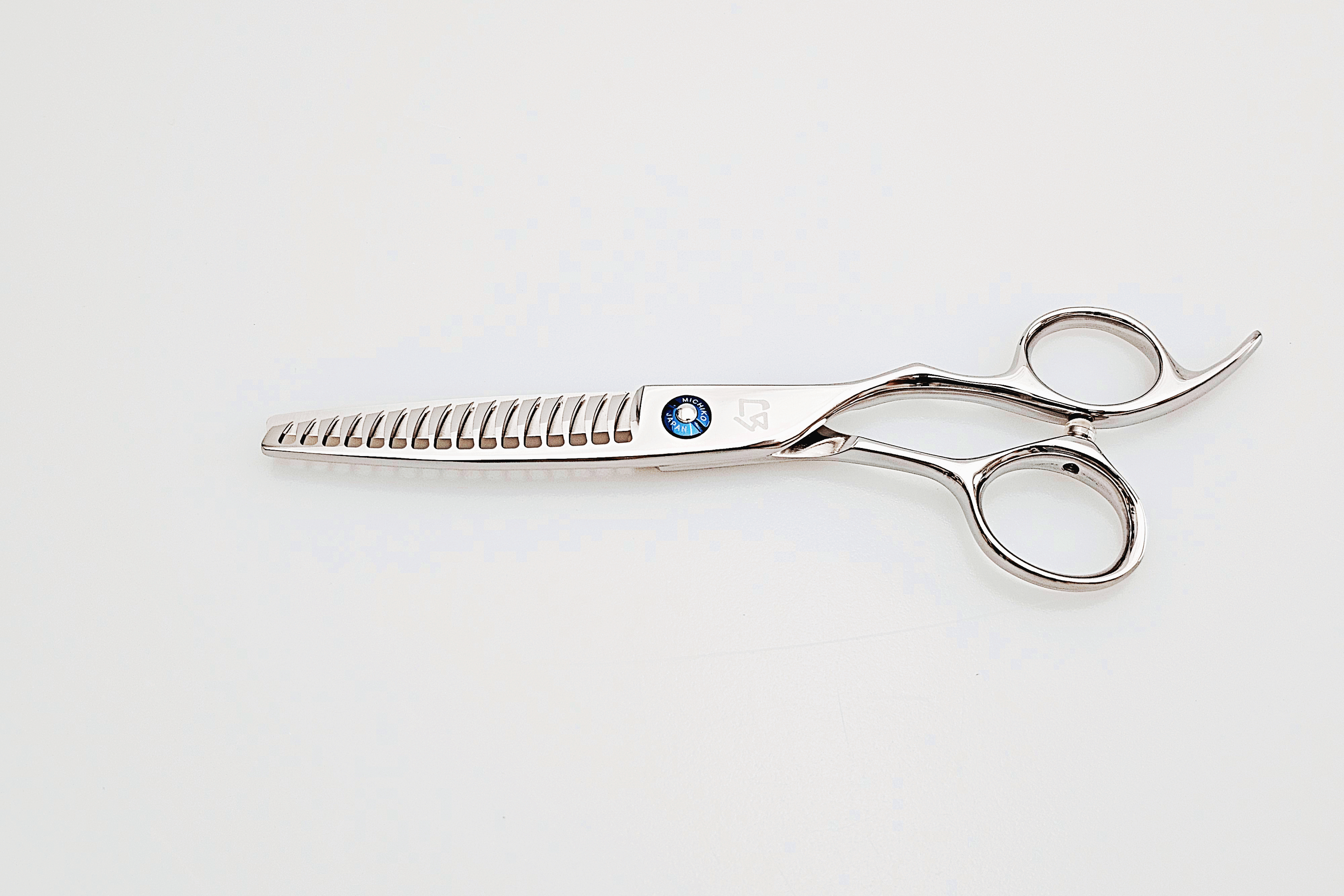 Hair cutting scissors with a visible brand logo on a white background