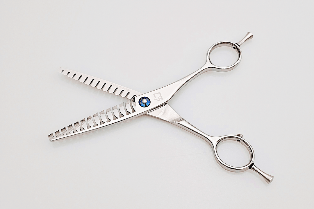 Double teeth hair texturizing scissors on a white background