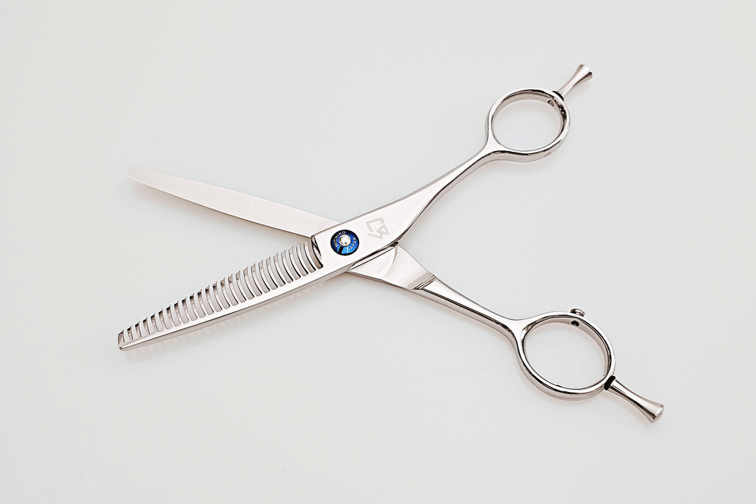 Hair scissors with a blue logo on a white background
