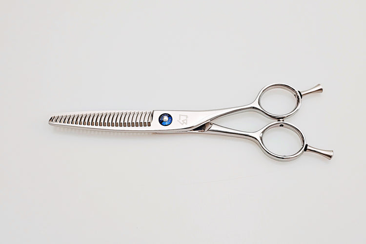 Hair cutting scissors on a light gray background