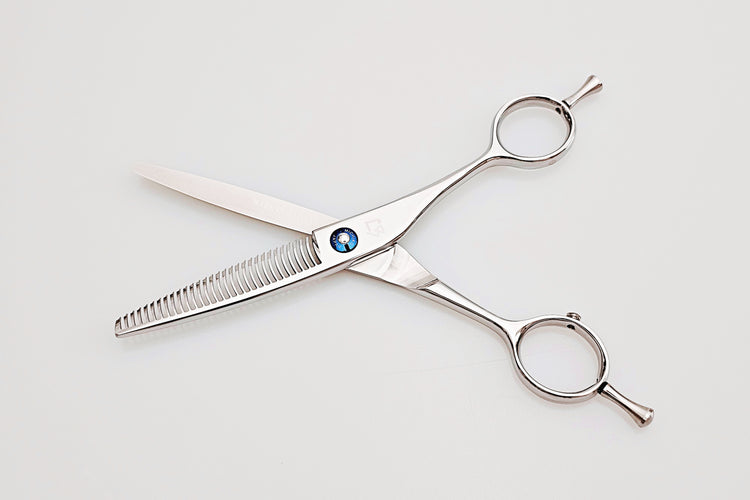 Pair of hair scissors on a white background