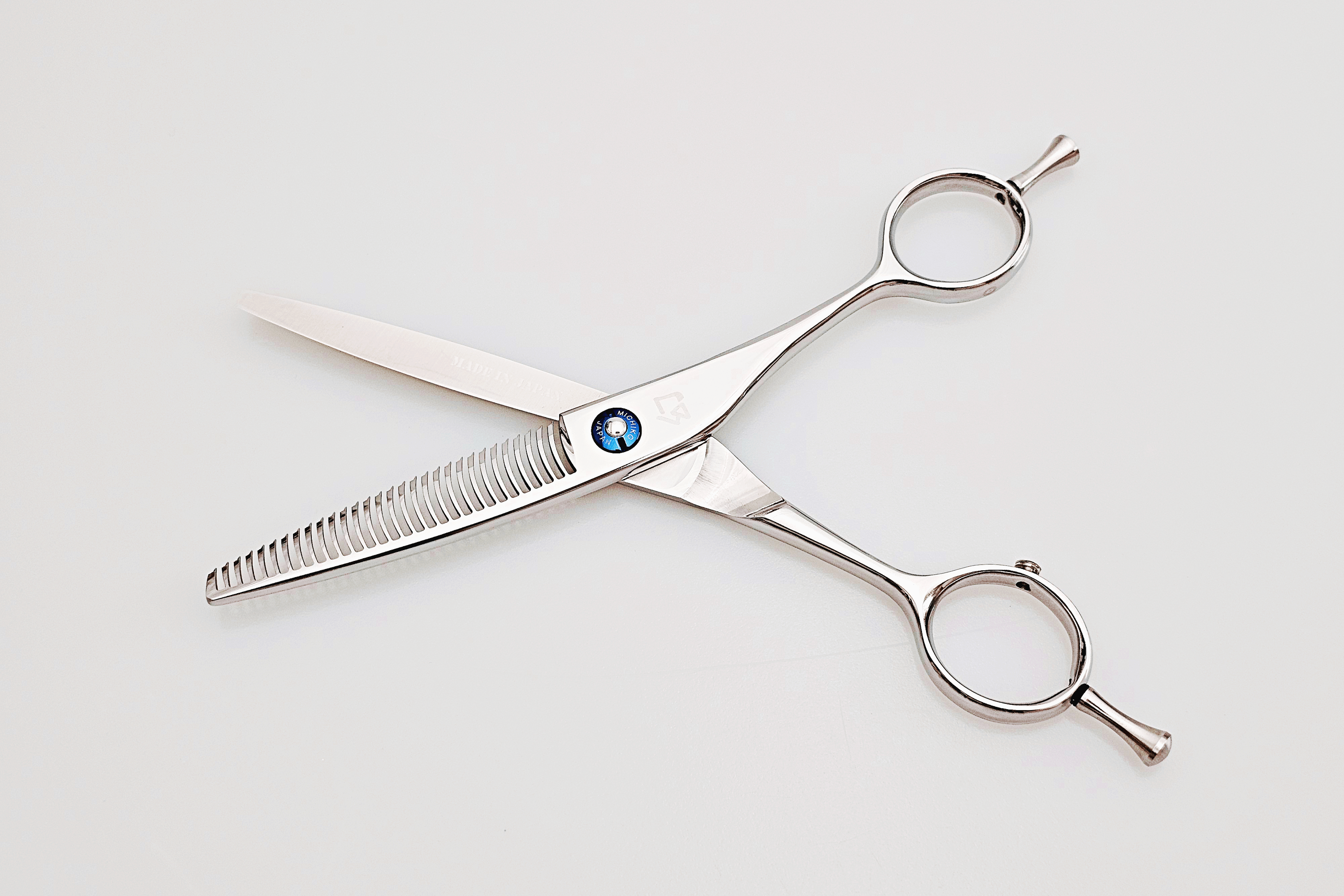 Pair of hair scissors on a white background