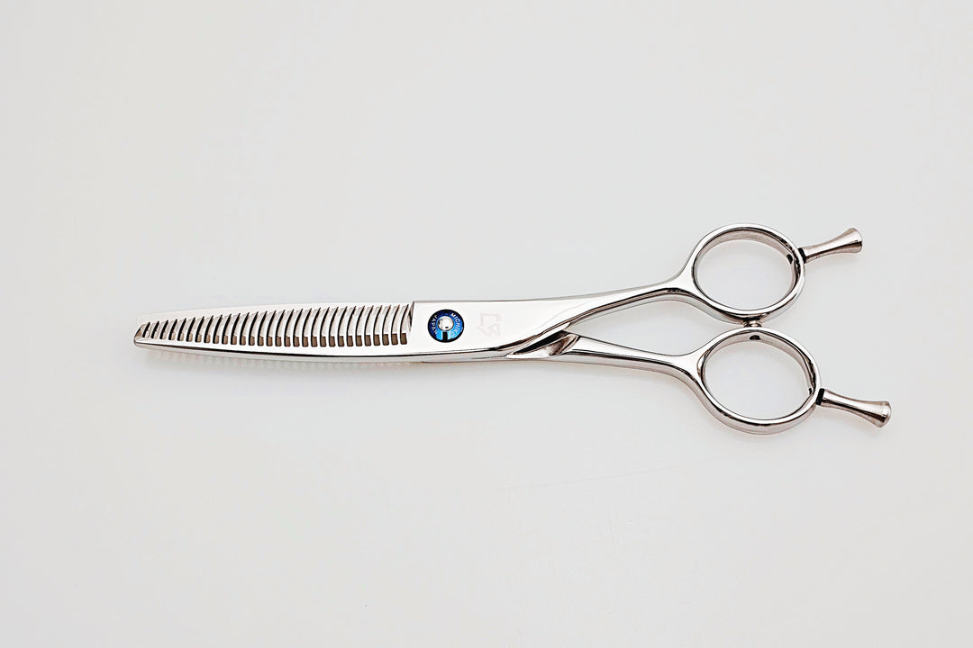 Hair cutting shears on a white background