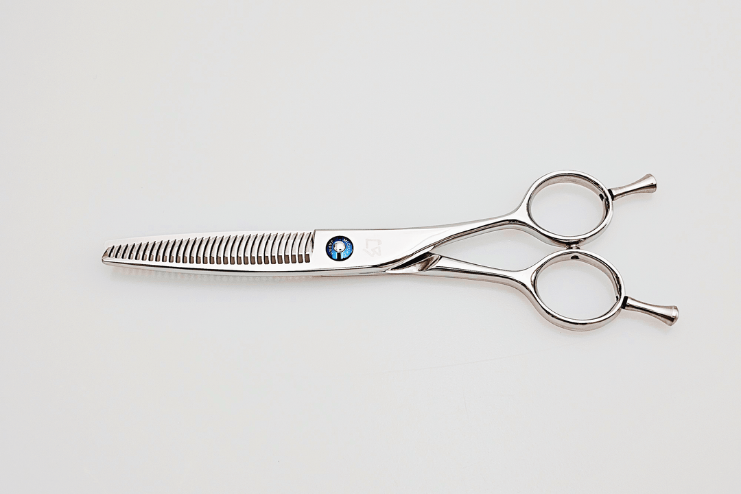 Hair cutting shears on a white background
