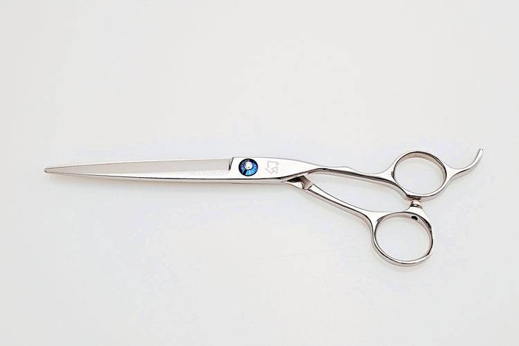 Stainless steel hair cutting shears on a white background