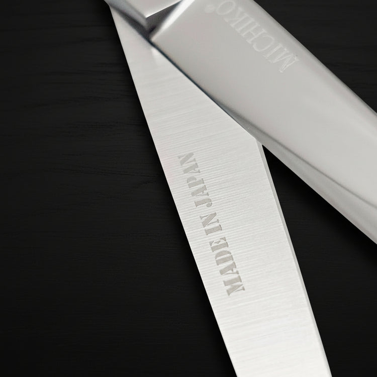 Professional Japanese Barber Shears with engraved 'Made in Japan' on the cutting blade.