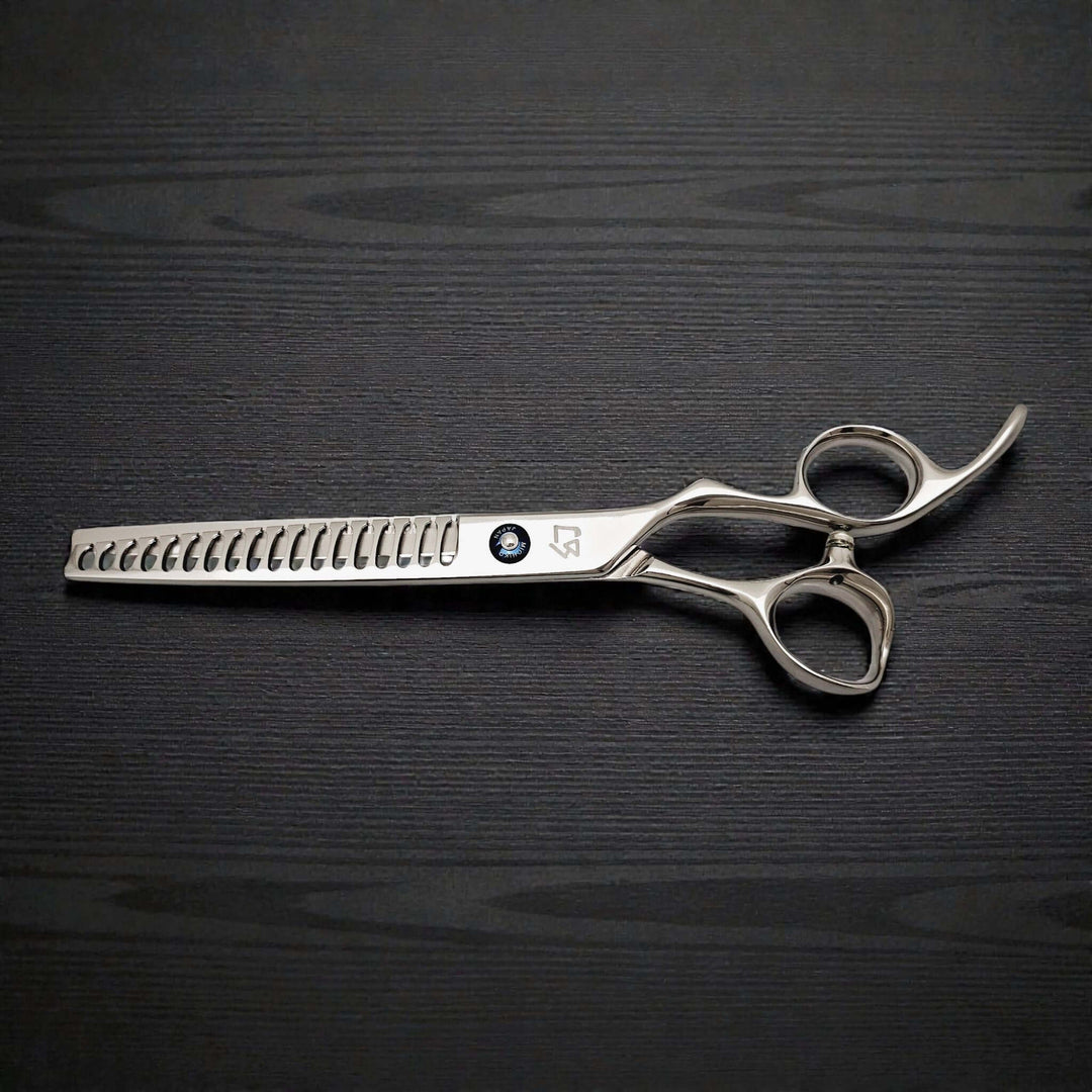 Japanese 7-inch hair-cutting scissors on a dark wooden surface.