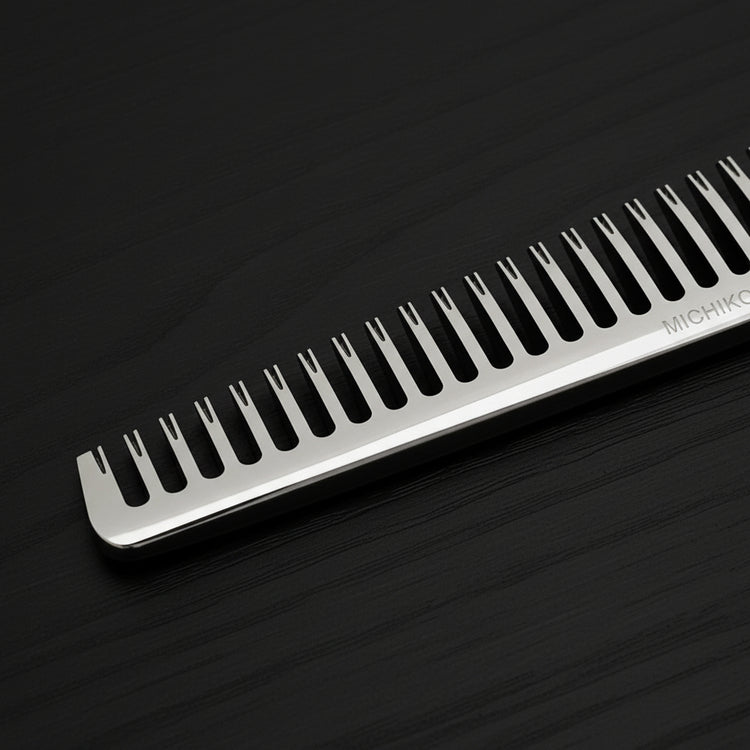 Close-up of hair thinning shears on a black background