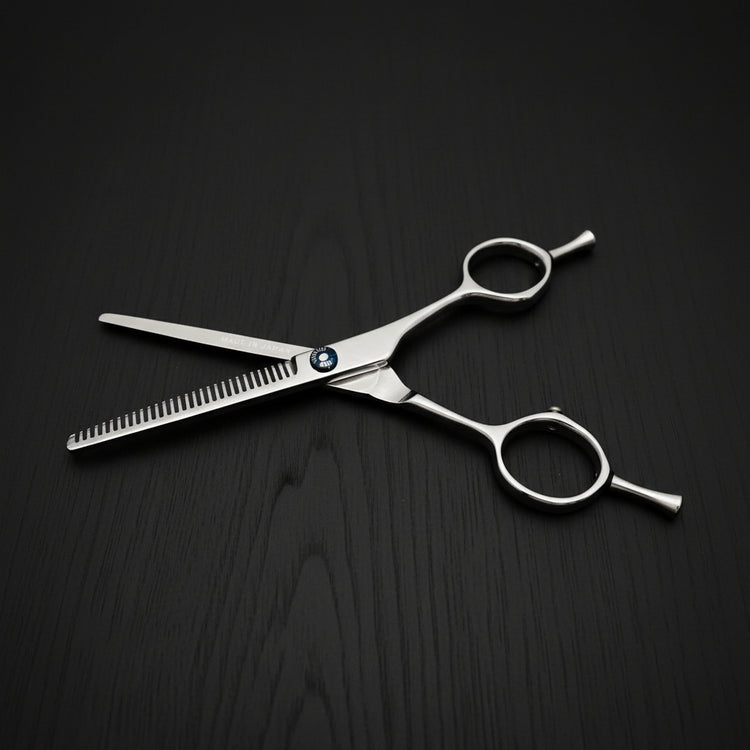 Hair thinning scissors on a black background