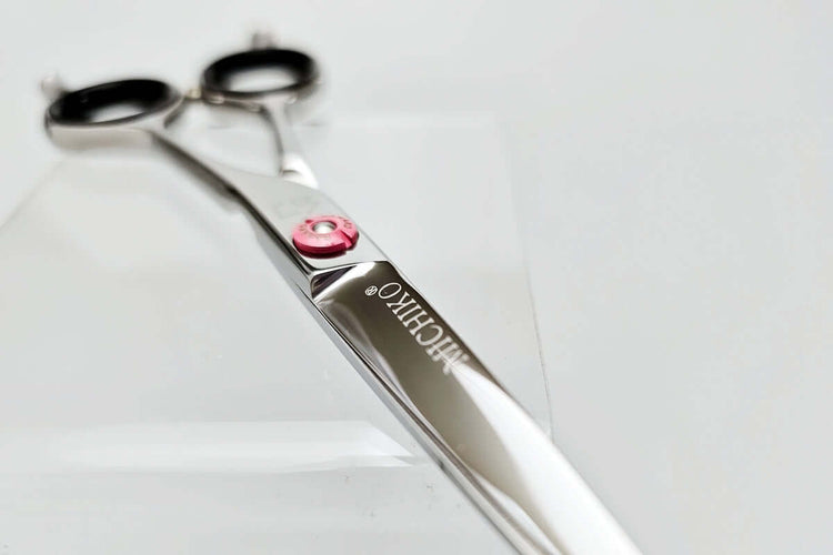 Hair cutting shears with 'MICHIKO' branding on a light gray background