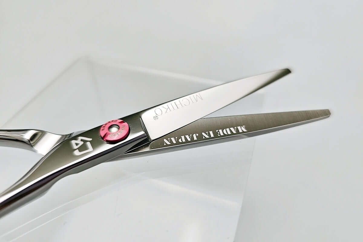 Hair cutting shears with 'Made in Japan' engraving on a white background