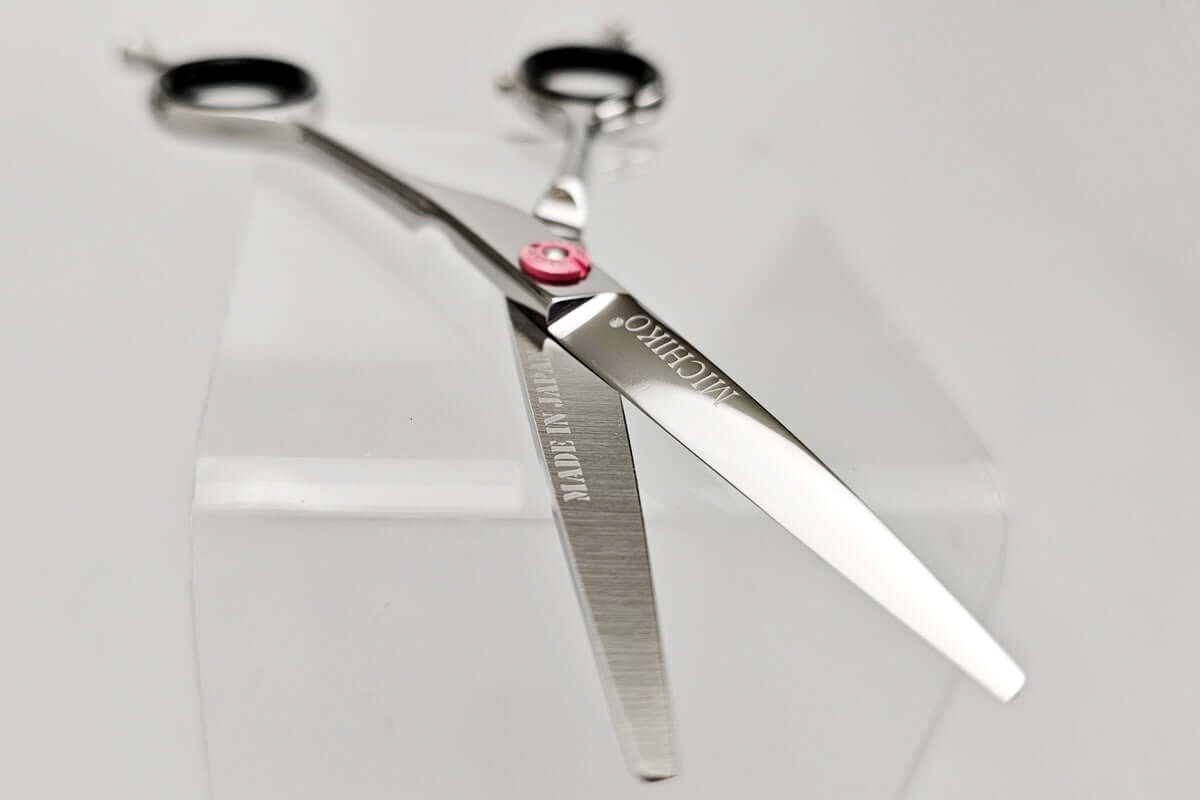 Pair of hair scissors with MICHIKO brand name on a white background