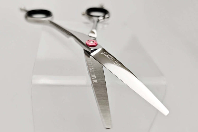 Pair of hair scissors with MICHIKO brand name on a white background
