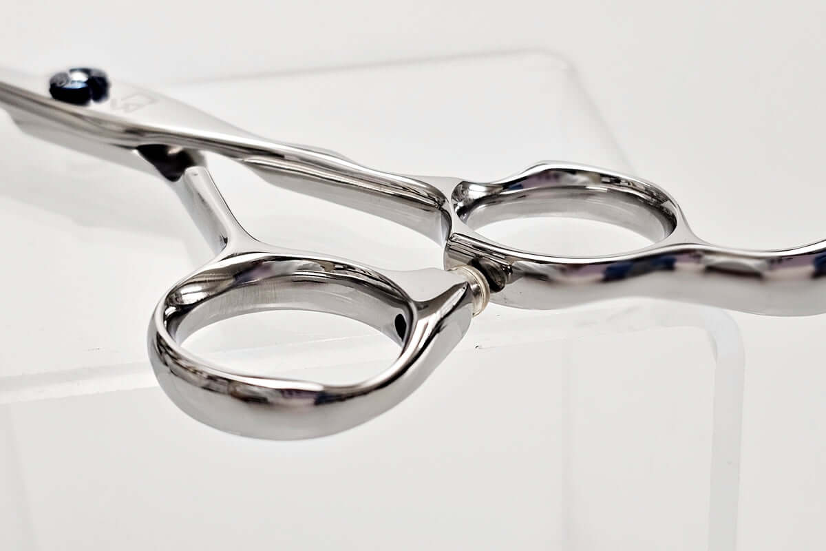 Close-up of a pair of hair scissors on a white background