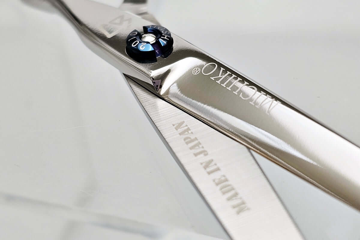 Close-up of Michiko hair scissors on a light gray background